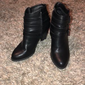 Black heeled buckle booties